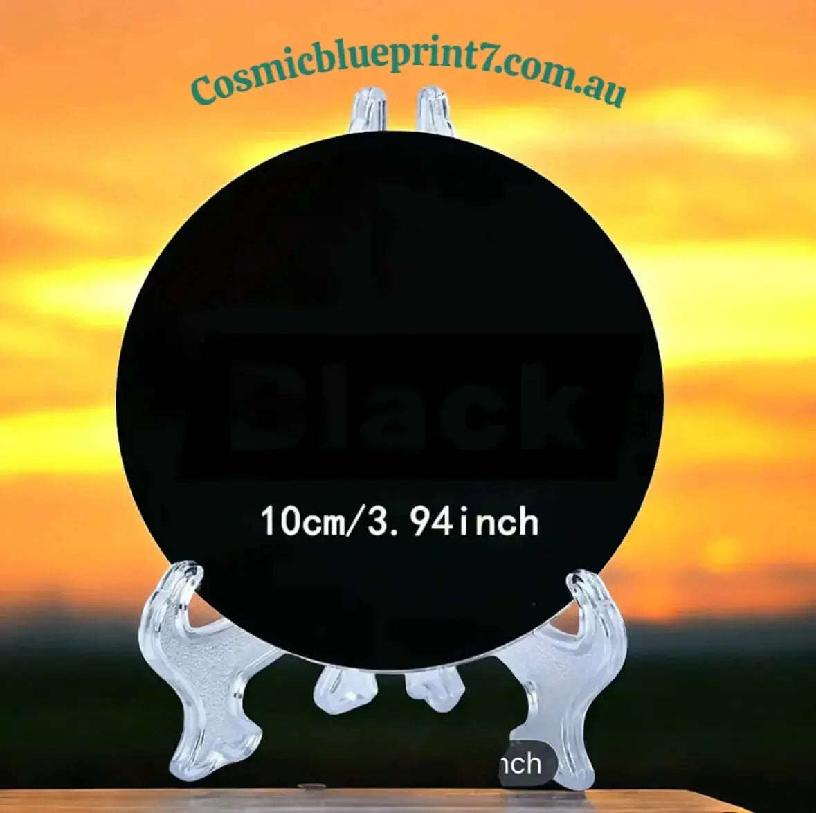 10cm Round Black Obsidian Mirror on a clear display stand for scrying and home energetic protection - Cosmic Blueprint 7 Australia