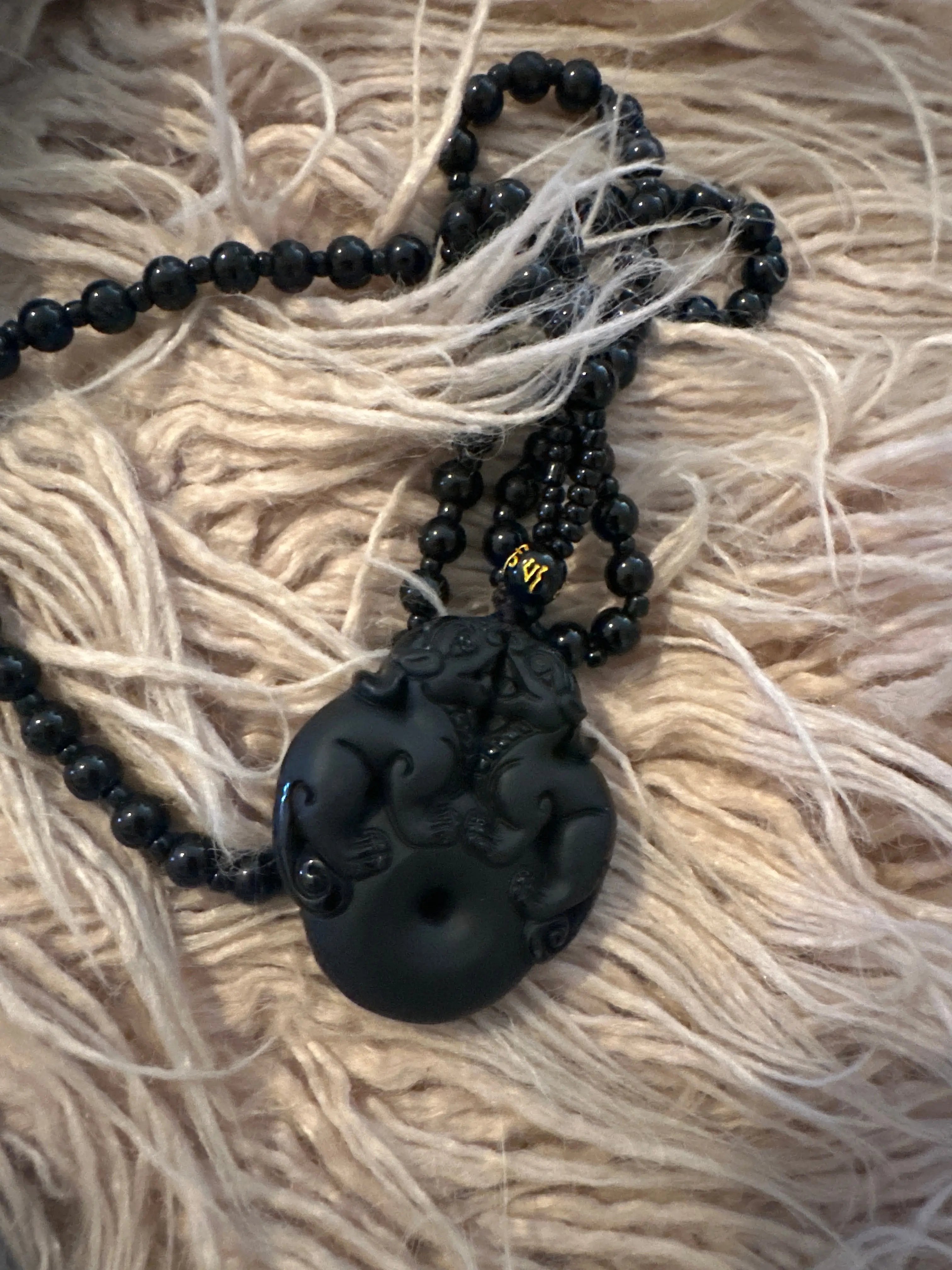 lose-up of genuine Black Obsidian beads and Double Pixiu pendant - Cosmic Blueprint 7